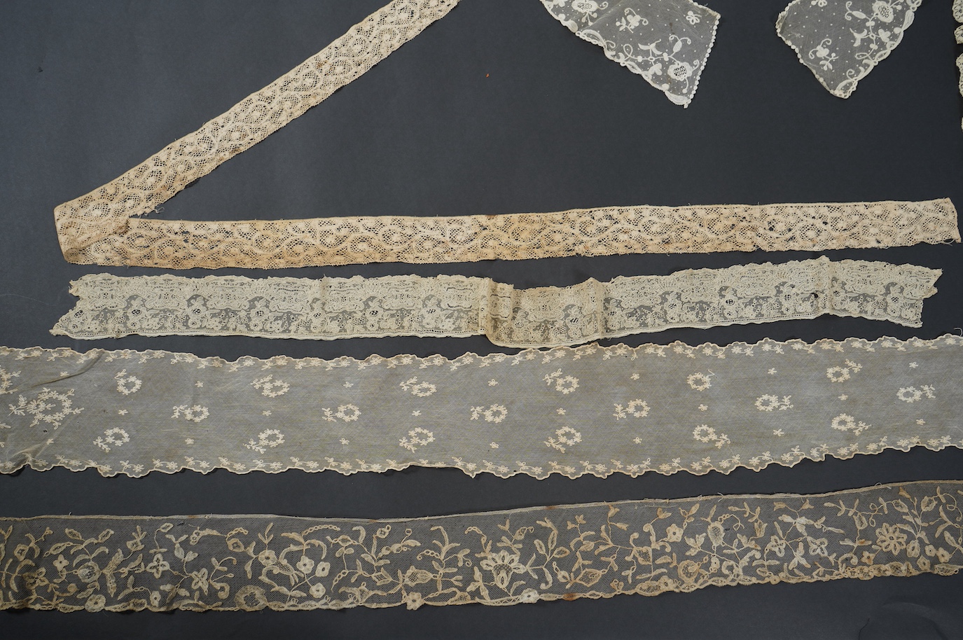 An early 19th bobbin lace length and a Brussels needle lace length, a Brussels bobbin lace wedding hankie and Brussels collar and length of trimming, a needle run collar and similar stole. (7). Brussels bobbin trim 250cm